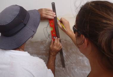 Jon and Amanda marking measurement stations on the hulls