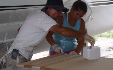 Jon & Amanda buttering foam joints together with epoxy mud