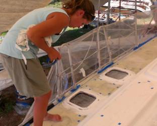 Amanda marking edges of antiskid with blue-tape