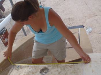 Amanda measuring for the swim platform steps