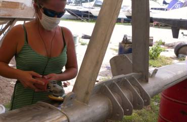 Amanda polishing the forebeam - lots of nooks and crannies