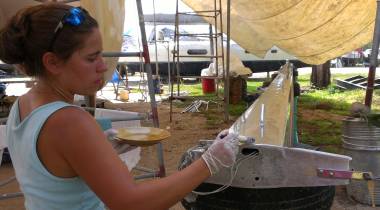 Amanda finishing applying Nyalic to the top of the mast