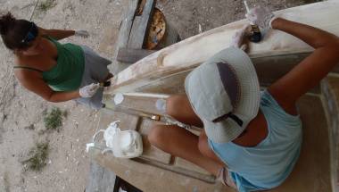 Amanda and Sue filling the newly cut holes with epoxy glass