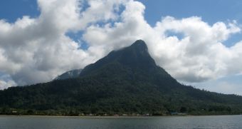 Santubong Peak over the river and village, outside Kuching, Malaysia