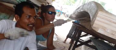 Baw & Amanda rolling epoxy into the glass under the bimini