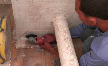 Baw cutting away delaminated fiberglass in the cockpit lockers