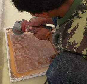 Grinding back the foam edges of Max's old hatch