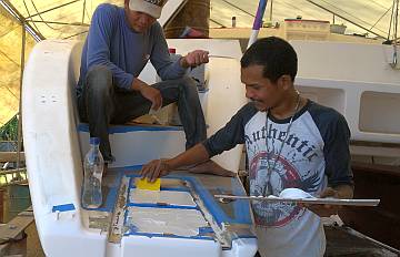 Heru & Baw spread glue on the last nonskid areas on deck