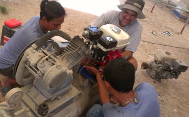 Houa, Baw & Jon fit the new motor onto our compressor