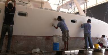 Baw, Lek, Pla & Nai sanding our newly re-sprayed port flank