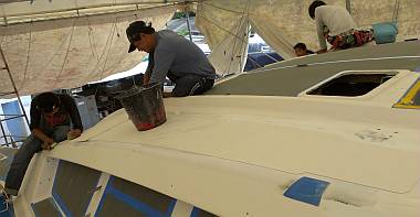 Baw, Pla, Chandron & Yando all cleaning the cabin-top