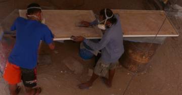 Ben and Lek sanding the undersides of the cockpit hatches