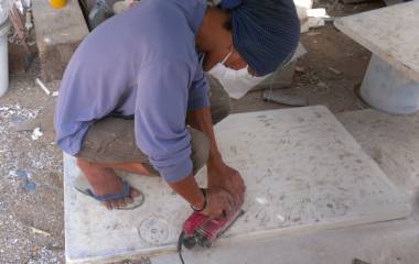 Jack sanding one of our big cockpit hatches to get teaked