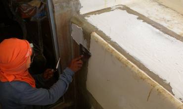 Chai putting several layers of filler around the companionway