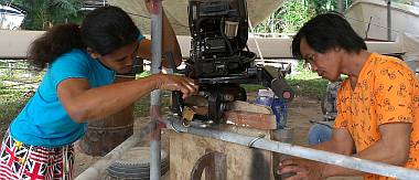 Chambron and Yando working on Tom Cat's engine