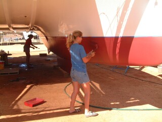 Amanda & Sue paint in the shade where it's cooler