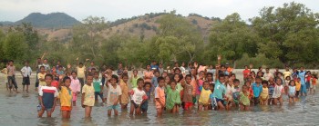 Kids from a village on Flores gather on the beach to see us off