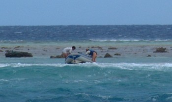 Jon and Sandra from Mariposa rescue our dinghy on a breaking shore