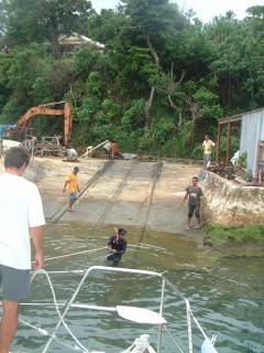 The railway workers position lines to center Ocelot for the haul out.