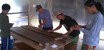 The guys sanding the cockpit table quickly before they leave