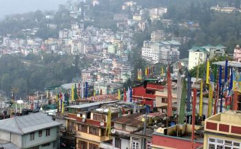 Prayer flags & roof-top view of Gangtok, Sikkim