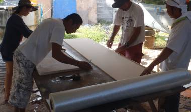 Mia, Golf, Jon & Boy all working on the hatch covers