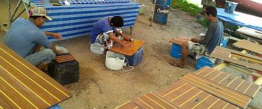 Sanding the gloss polyurethane to prepare for the satin