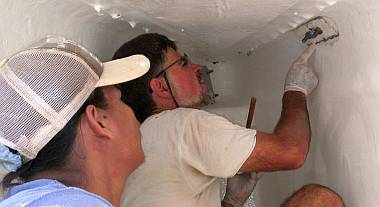 Heru & Jon installing the starboard forward cleat backing plate