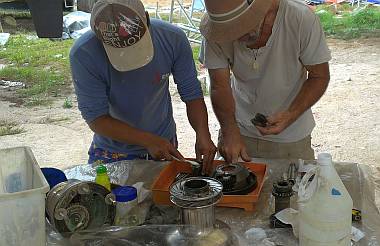 Jon showing Heru how to strip, clean, and re-grease winches