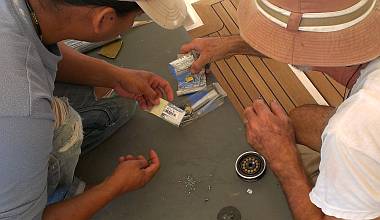 Rebuilding the dinghy-hoist block - sand in center is old balls