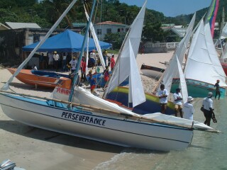 Small boats pulled up on shore between races