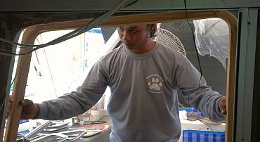 Checking the teak door-frame with the aluminum frame in place