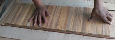 Houa's teak strips, lined up to be cut into lattice pieces