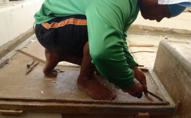 Houa removing his wood frames after the glass has set