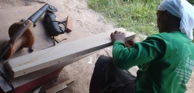 Houa in the "workshop" working on the entryway threshold