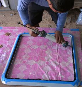 Silicone is shot into the tray of the cleaned frame