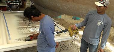 Houa and Heru grinding bad gelcoat off the front of the bimini