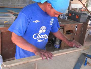 Houa working on teak trim in his workshop