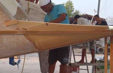 Houa working on the port-side transom extension