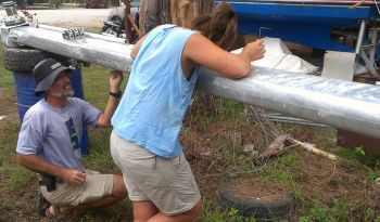 Jon & Amanda repositioning halyard lines inside the mast