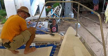 Jon mounts the starboard pulpit while Baw beams below