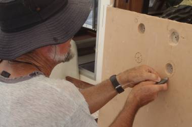 Jon removing foam so we can put epoxy mud around bolt holes