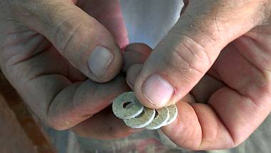 Simple non-conductive washers, drilled out of a fiberglass sheet