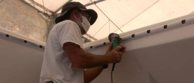 Jon turning trampoline support holes (left) into slots (right)