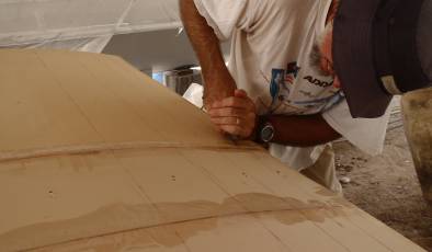 Slicing the foam with a razor blade to make it bend more easily