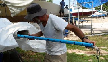 Jon runs a test piece of conduit up the mast