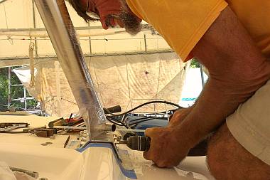 Drilling 10mm holes to mount the bottoms of the bimini legs