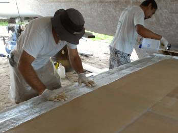 Laying down the first strip of biaxial glass at the back