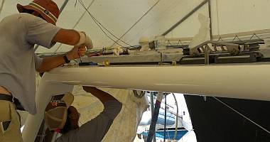 Jon and Heru working on the mainsail track on the targa-bar