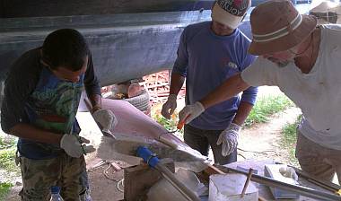 Laying the top pieces of glass on the epoxied steel